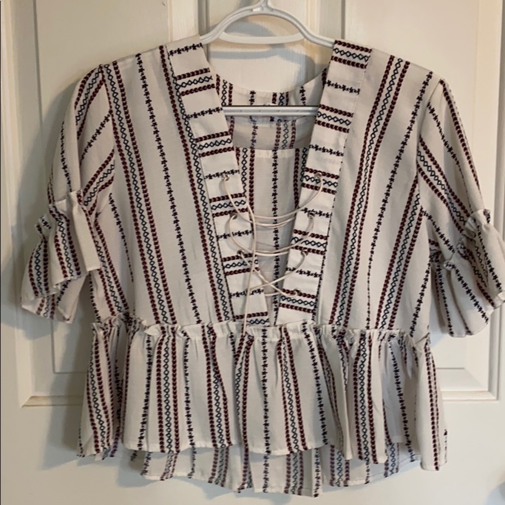 Cropped loose peplum top.